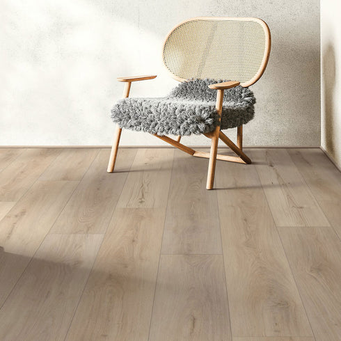 Chair with woven backrest and fluffy cushion on Genova Oak COREtec LVP flooring.