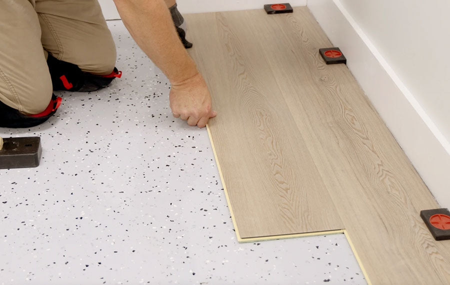 Photo of COREtec flooring being installed.